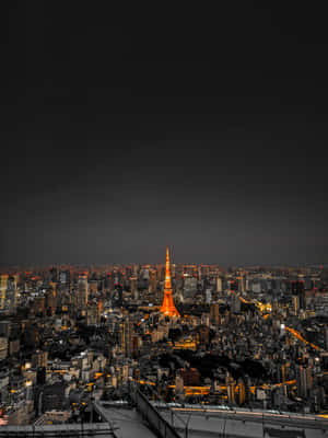 東京鐵塔在夜間照亮密集的城市景觀。 — 日式自然壁紙