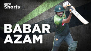 板球運動員Babar Azam身穿綠色隊服揮動球拍，帶有ESPN文字疊加。 — 孟加拉板球 壁紙