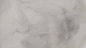 帶有斑點紋理的抽象灰色和白色漩渦圖案。 — 低對比 壁紙