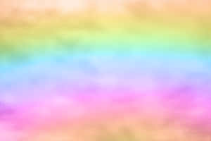 有紋理表面上的柔和粉彩彩虹漸變。 — 彩虹美學 壁紙