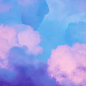 粉彩粉紅和藍色雲在寧靜的天空中飄浮。 — iPad Pro 11 壁紙