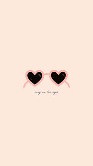 淡蜜桃色背景上帶有 easy on the eyes 文字的心形太陽眼鏡。 — 乾淨 壁紙