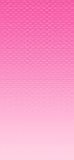 帶有精細圓點圖案的粉紅色漸變背景，適用於數位用途。 — iPhone 17 壁紙