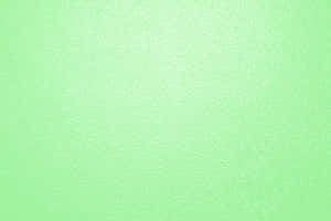 薄荷綠色紋理壁紙，帶有細微波浪圖案和漸變效果。 — MacBook Pro M2 壁紙