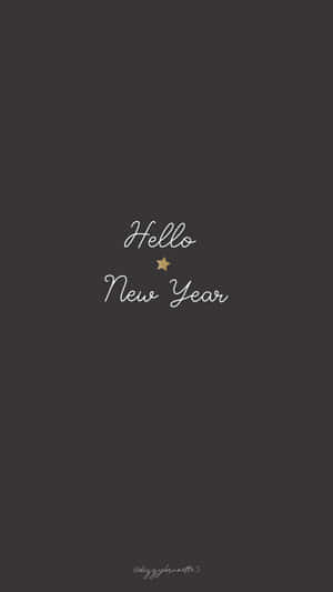 深灰色背景，白色草書文字寫著 Hello New Year 和一顆小金星星。 — 慶祝 壁紙