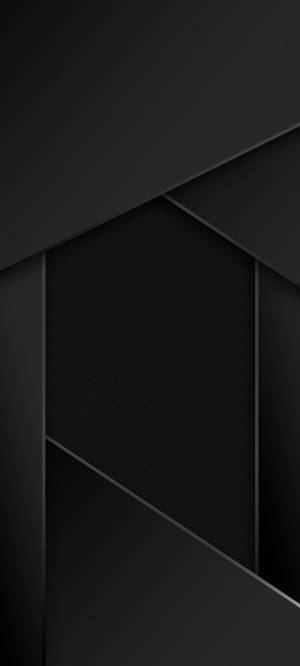 抽象黑色幾何圖案，帶有角平面和紋理表面。 — Pixel 9 壁紙
