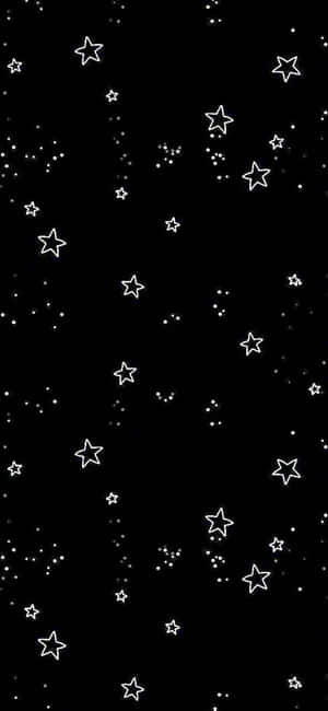 黑色背景搭配白色星星和圓點，營造宇宙夜空效果。 — 星星 壁紙