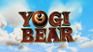 Yogi Bear 標誌，熊臉在 O 中，背景是藍天白雲 — 可愛熊 壁紙