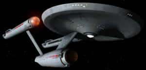 深空中的星艦企業號NCC-1701，帶有發光的引擎。 — 太空船 壁紙
