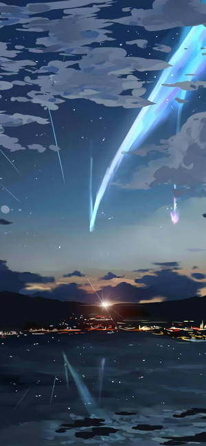 黃昏時分的海岸小鎮，發光流星劃過天空，倒映在水中。 — 你的名字 GIF 壁紙