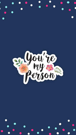海軍藍色背景，帶有 'You're my person' 文字和花卉設計，周圍環繞著彩色紙屑。 — Instagram限時動態 壁紙