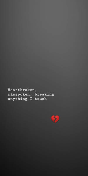 文字為 heartbroken misspoken breaking anything I touch，並附有紅色破碎心形圖示。 — 悲傷語錄 壁紙