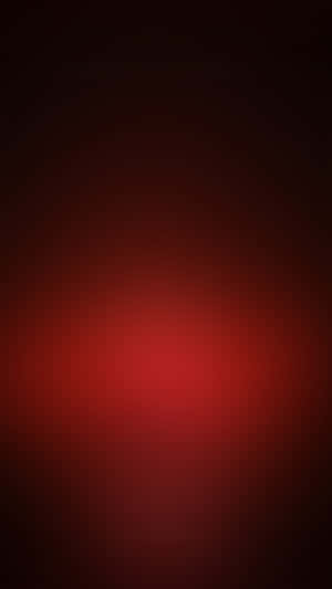 明亮的紅色漸變逐漸消失在黑暗中。 — 紅色美學 iPhone 壁紙