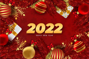 紅色和金色的2022年新年裝飾，配有松枝和禮物。 — 新年快樂 2020 壁紙