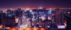 夜晚廣闊的城市，發光的建築與繁忙的街道。 — 台北 壁紙