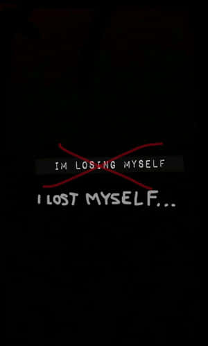 文字疊加顯示「I LOST MYSELF...」，之前用紅色劃掉了「IM LOSING MYSELF」。 — Tecno Megapad Pro 壁紙