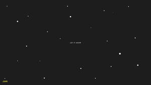 深色背景上有白色雪花點點和置中的文字 let it snow。 — 冬季美學 壁紙