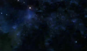 廣闊的黑暗空間，充滿發光的藍色星雲和閃爍的星星。 — 宇宙 壁紙