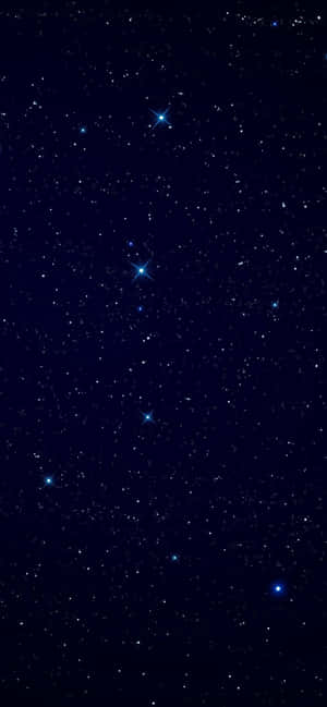 帶有亮藍色星星和深藍色背景的星空夜空。 — Galaxy A54 壁紙