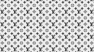 淺灰色背景上的黑白 Louis Vuitton 字母組合圖案。 — 美麗的秋天 壁紙