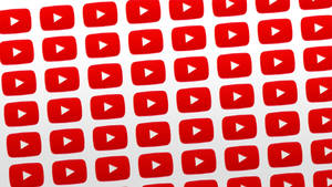 紅色 YouTube 播放按鈕以網格圖案排列。 — YouTube 標誌 壁紙