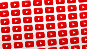 紅色 YouTube 播放按鈕圖標以重複網格圖案排列。 — YouTube 標誌 壁紙