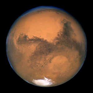 火星，表面呈鏽色，帶有極地冰蓋。 — 火星人布魯諾 壁紙