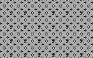 灰色背景，帶有重複的黑色 Louis Vuitton 標誌和花卉符號。 — 桌面美學 壁紙