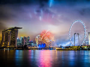 煙火在新加坡標誌性的天際線和海濱上空夜間綻放。 — 慶祝 壁紙