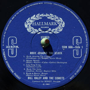 Bill Haley and the Comets 的《Rock Around The Clock》復古藍色黑膠唱片標籤。 — 復古 壁紙