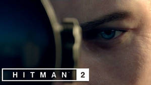Hitman 2 中透過步槍瞄準鏡看到的藍眼睛特寫。 — 狙擊手 壁紙