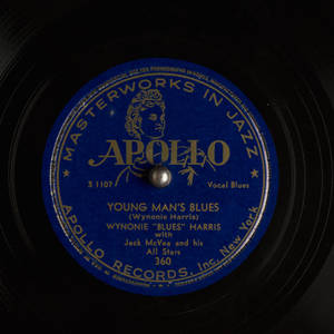 特寫鏡頭：一張復古Apollo Records黑膠唱片標籤，藍色背景配金色文字。 — 音樂 壁紙