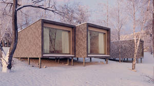 白雪覆蓋的冬季森林中的高蹺式現代小屋。 — 冬季房屋 壁紙