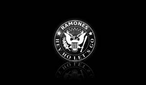 發光的 Ramones 標誌，帶有鷹和星星，在黑色背景上帶有倒影。 — Off white 標誌 壁紙