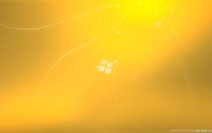 Windows標誌在帶有光條的金色抽象背景上。 — 金色動態 壁紙