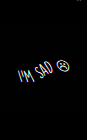 霓虹文字顯示 I'M SAD 並帶有悲傷表情符號在黑色背景上 — 悲傷抑鬱 壁紙