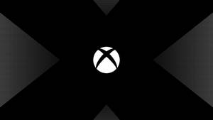 黑色背景上的白色Xbox標誌與半色調漸變三角形。 — X Games 壁紙