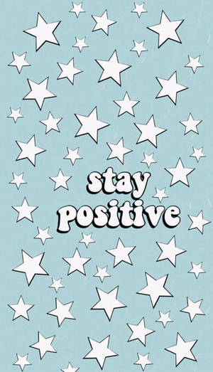 藍色背景上有白色星星和stay positive字句。 — 美學 壁紙