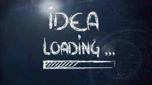 深色表面上的粉筆字顯示「IDEA LOADING」及進度條。 — 藍色美學電腦 壁紙