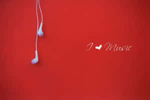 紅色背景上的白色耳機和「I ♥ Music」文字。 — 美學音樂 壁紙