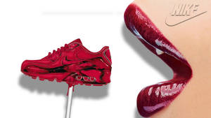 紅色Nike Air Max運動鞋棒棒糖旁邊有紅色唇彩管。