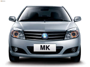 帶有橙色飾邊頭燈和「MK」車牌的銀色轎車。 — 好看汽車 壁紙