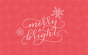 珊瑚色背景上帶有雪花的 Merry and bright 節日問候。 — 十二月 壁紙
