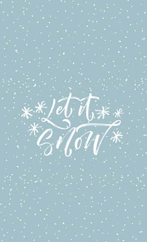 藍色背景上帶有雪花和 Let it Snow 文字 — Galaxy Tab S9 FE 壁紙