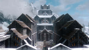白雪覆蓋的石建築和山村中的大教堂。 — 美學天空 壁紙