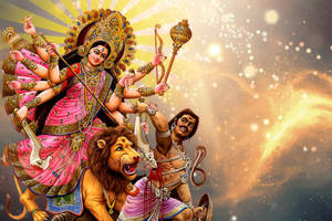 十臂女神杜爾迦騎著獅子與惡魔戰鬥，身後有宇宙之光。 — Maa Durga 壁紙