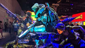 打扮成未來戰士的Cosplayer在展會上以發光武器擺姿勢。 — 邊緣禁地3 壁紙