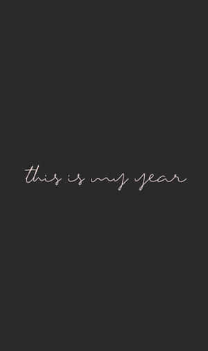 深灰色背景，白色草書文字寫著 this is my year — Tecno Megapad 壁紙