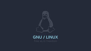 深藍色背景上的Tux企鵝標誌及GNU Linux文字 — Linux 壁紙