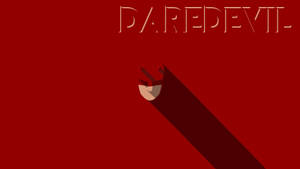 一隻帶有長影的風格化手，在紅色背景上，帶有 Daredevil 字樣。 — 夜魔俠 壁紙